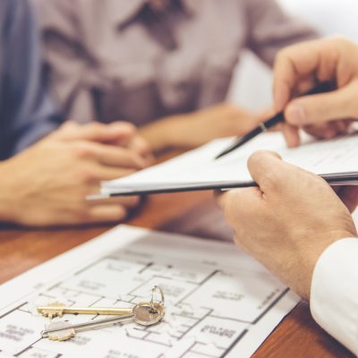 Cropped,Image,Of,Beautiful,Couple,Talking,With,Realtor,,Who,Is